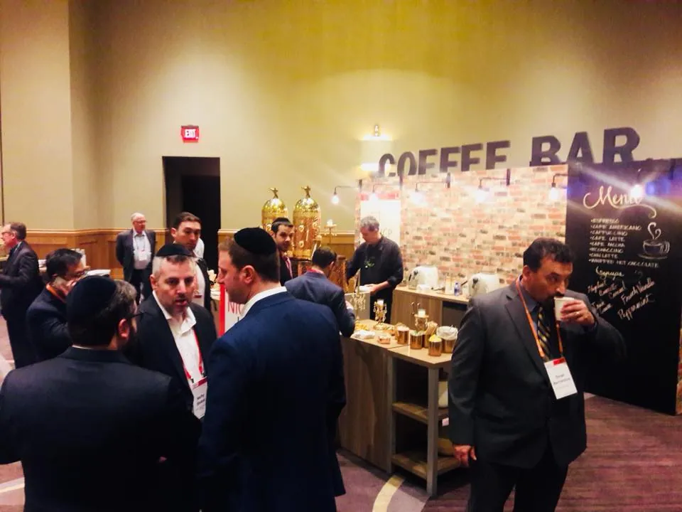 Guests gathering around Chic Coffee Events at a busy conference